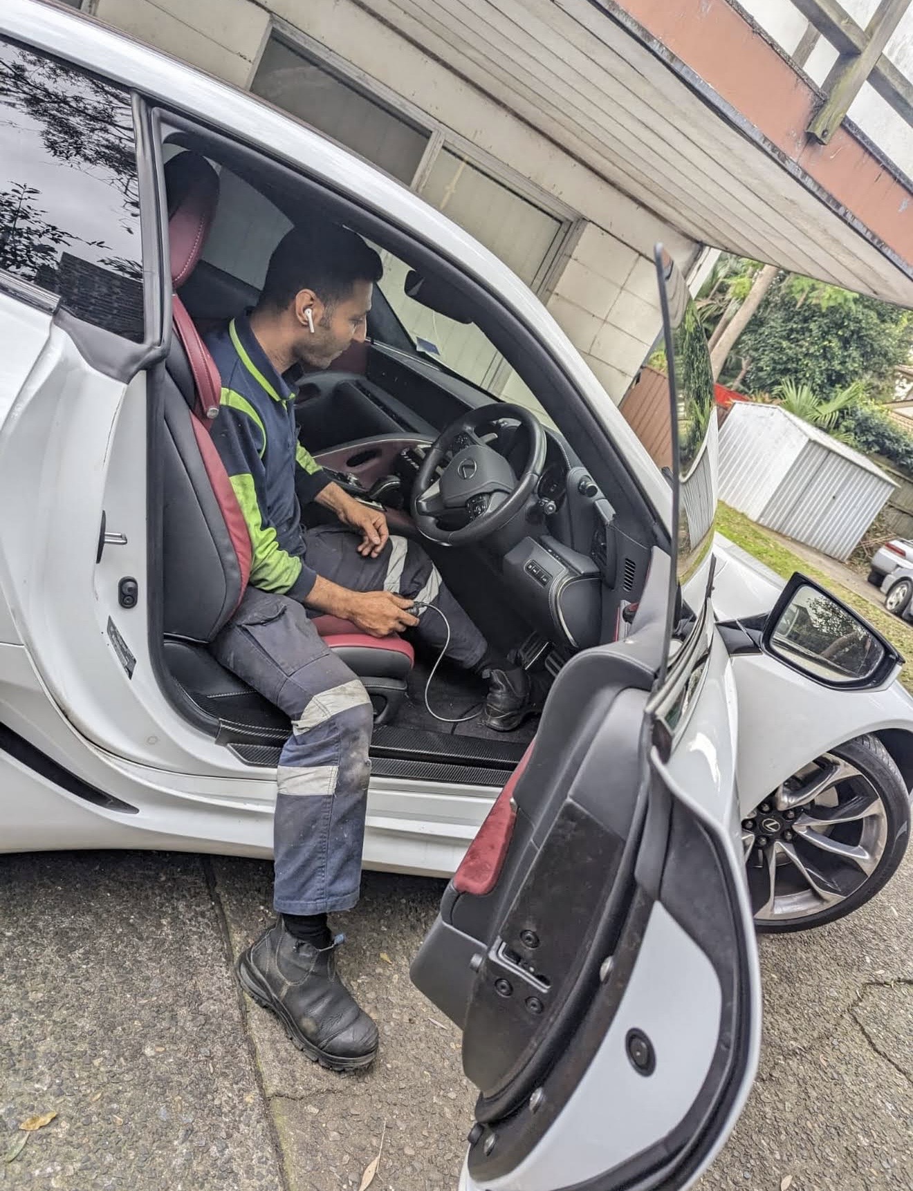 Mehdi running OBD2 diagnostics from the driver seat of a Lexus